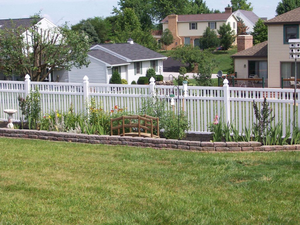White vinyl fencing with garden